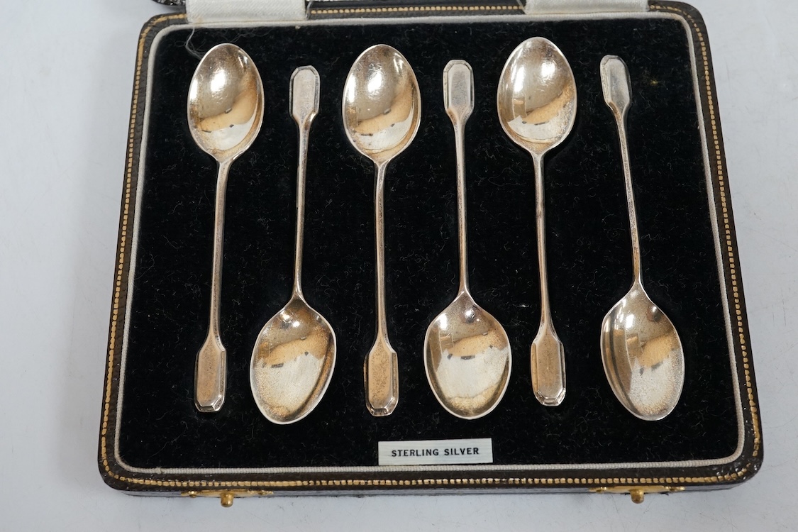 Three assorted silver christening sets including spoon, fork and napkin ring by William Hutton & Sons, London, 1896, one other set with steel knife, two cased sets of silver coffee spoons and a cased set of six Japanese
